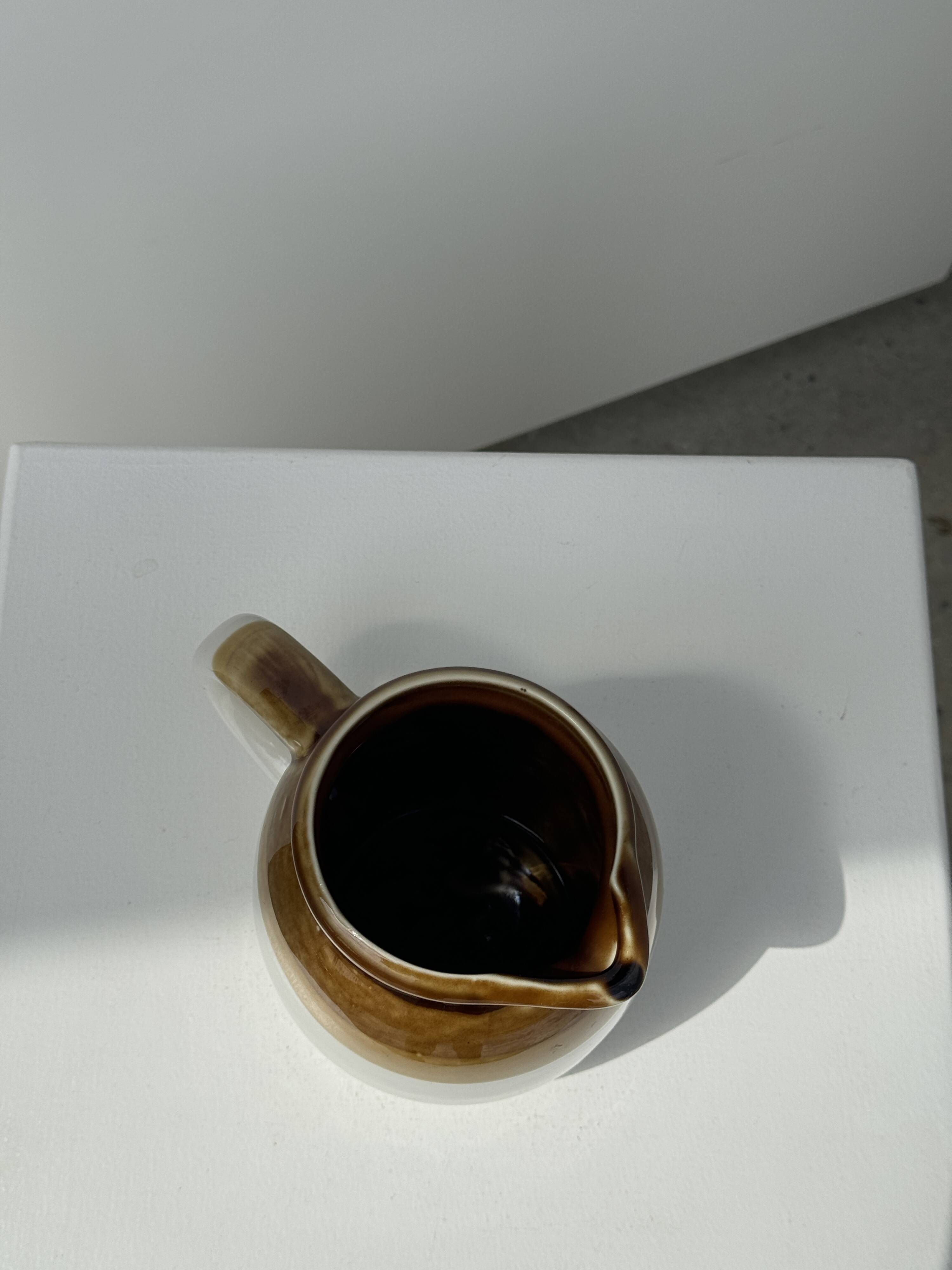 Small two-tone white and brown pitcher Made in China