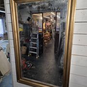 Golden mirror in oak from the 19th century.