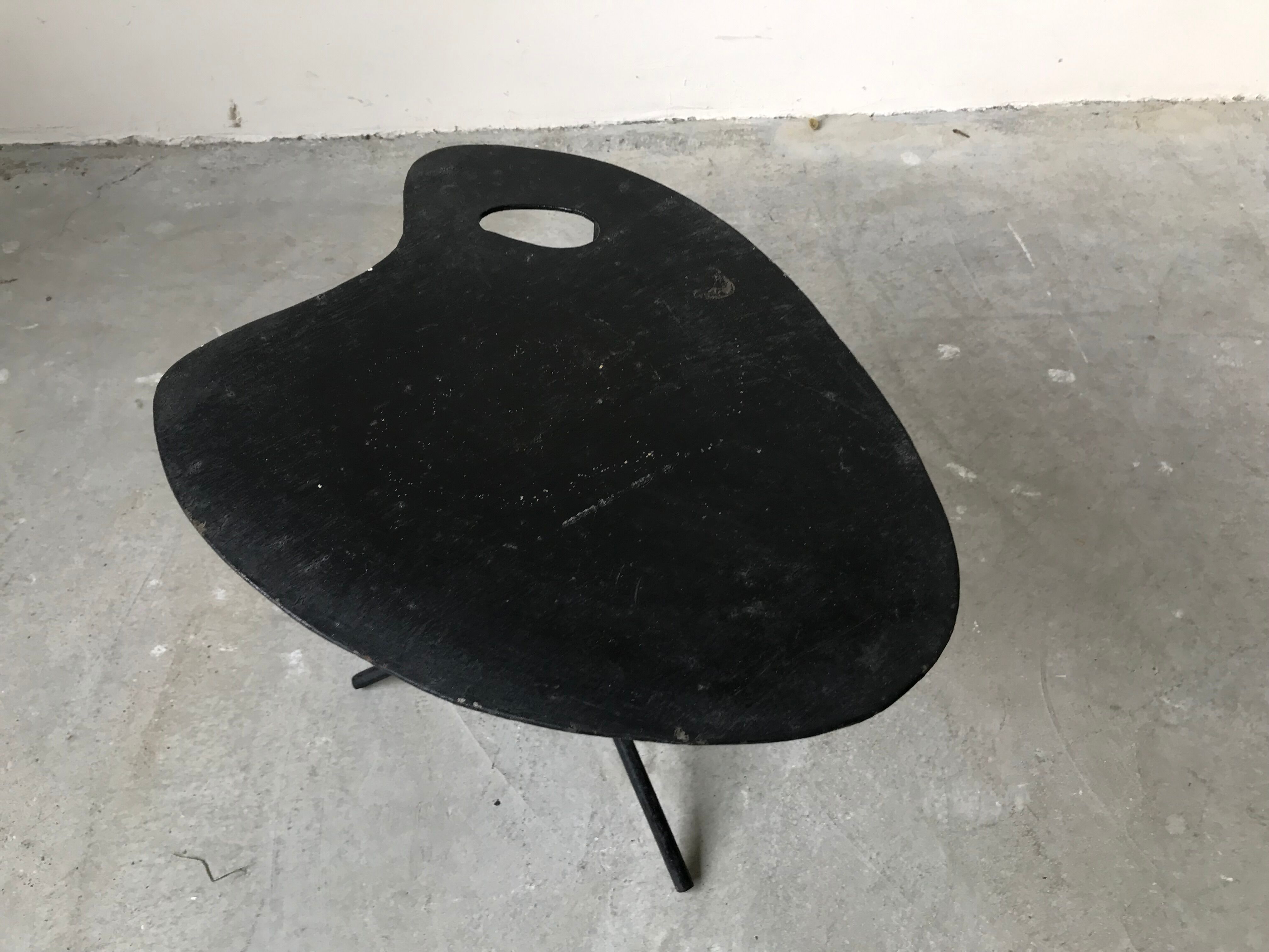 Side table in black lacquered metal, circa 1950.