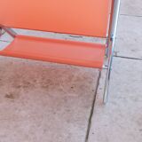 Vintage chrome and orange magazine rack from the 70s and 80s