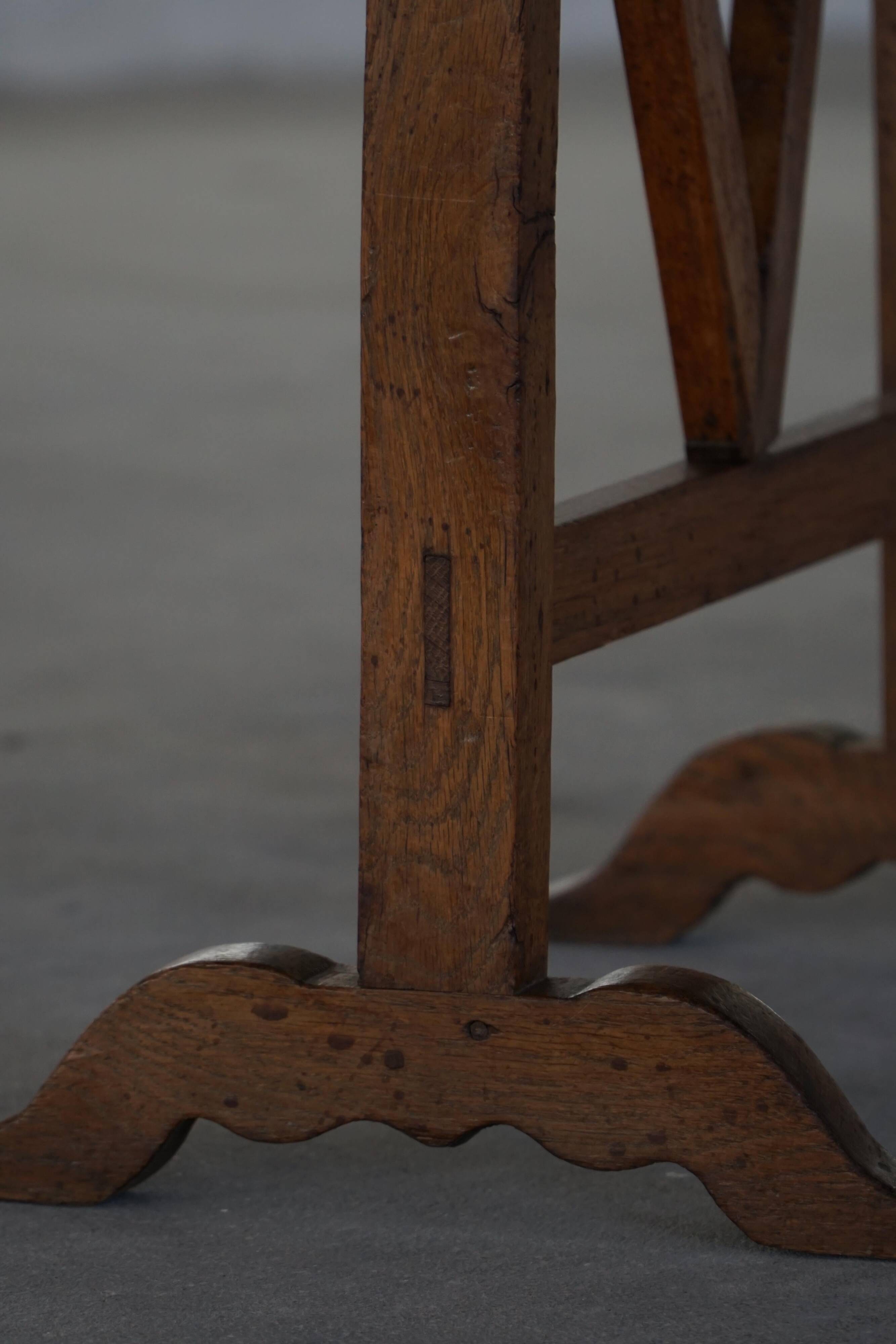 19th-century French round wine table with an adjustable top and floral textile surface.