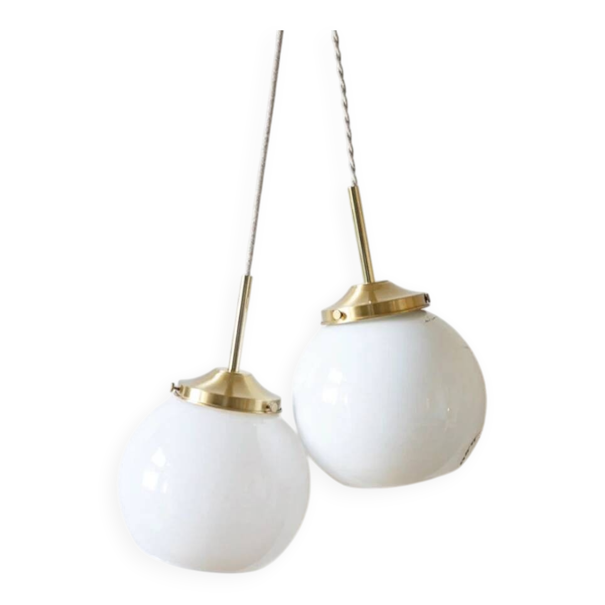 A pair of white opaline and brass suspensions.