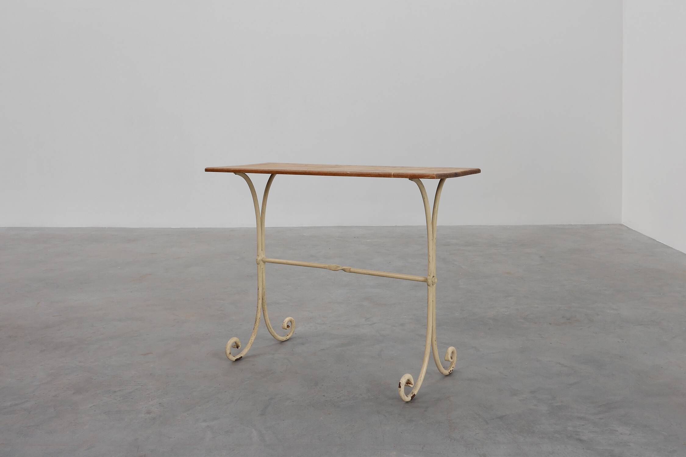 20th century French bistro table with cast iron base and oak top