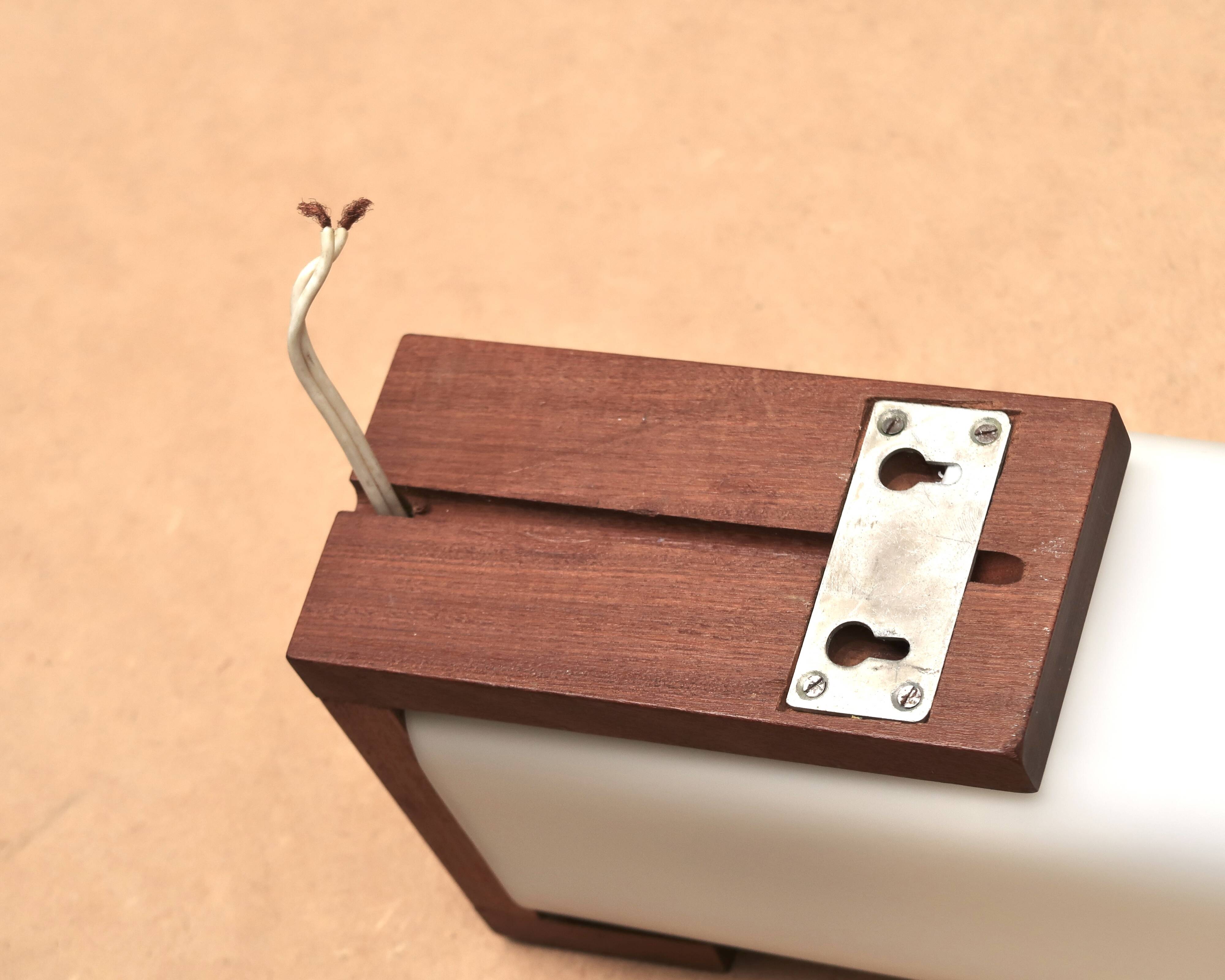 Teak and opaline wall light by Louis Kalff, 1950s