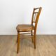 Pair of curved wood bistro chairs and studded and perforated seat