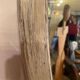 Large old oval mirror with beige patina wooden frame early 20th century