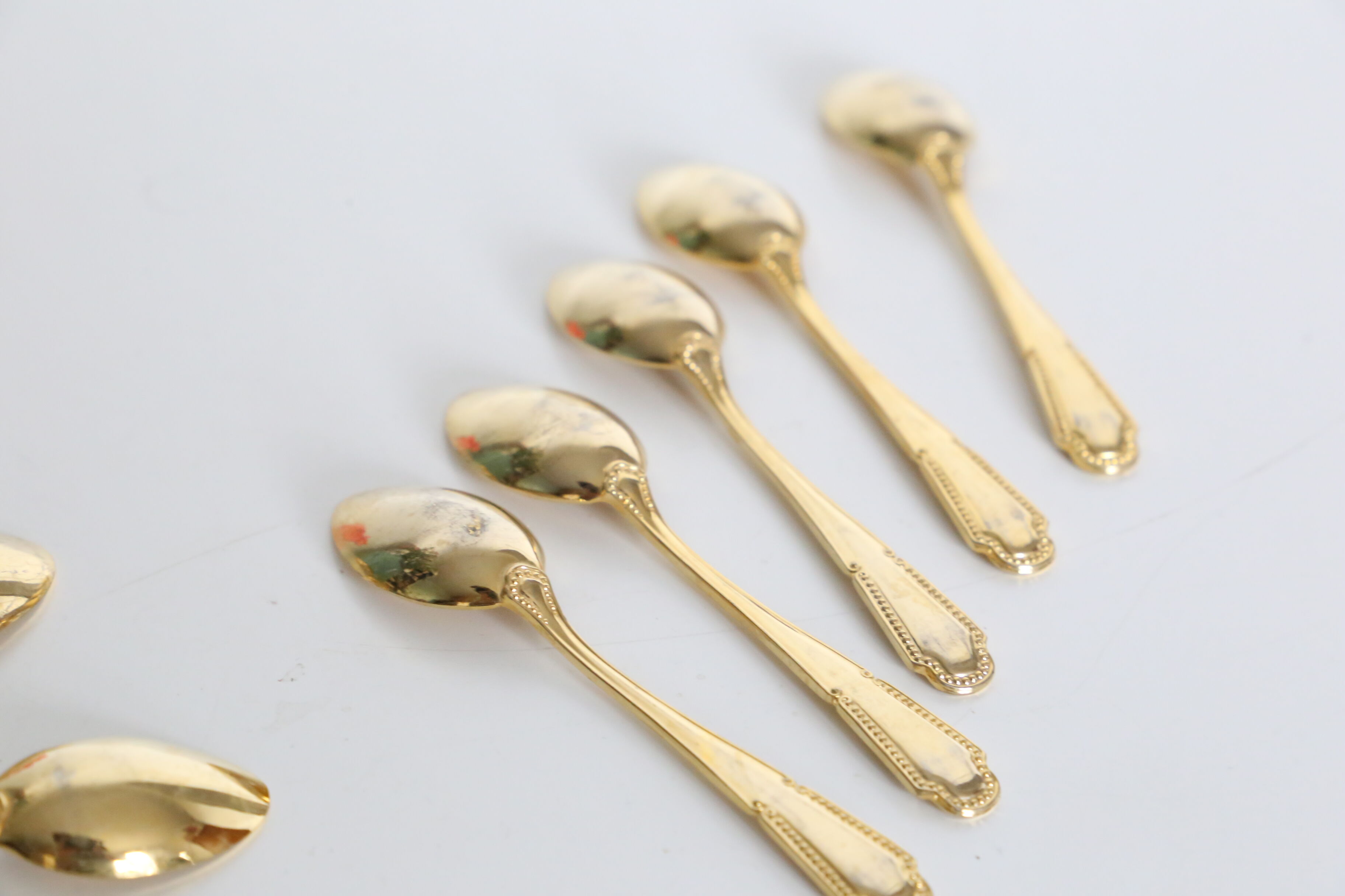 Service of 9 small golden spoons, vintage