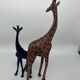 2 girafes en bois sculpté