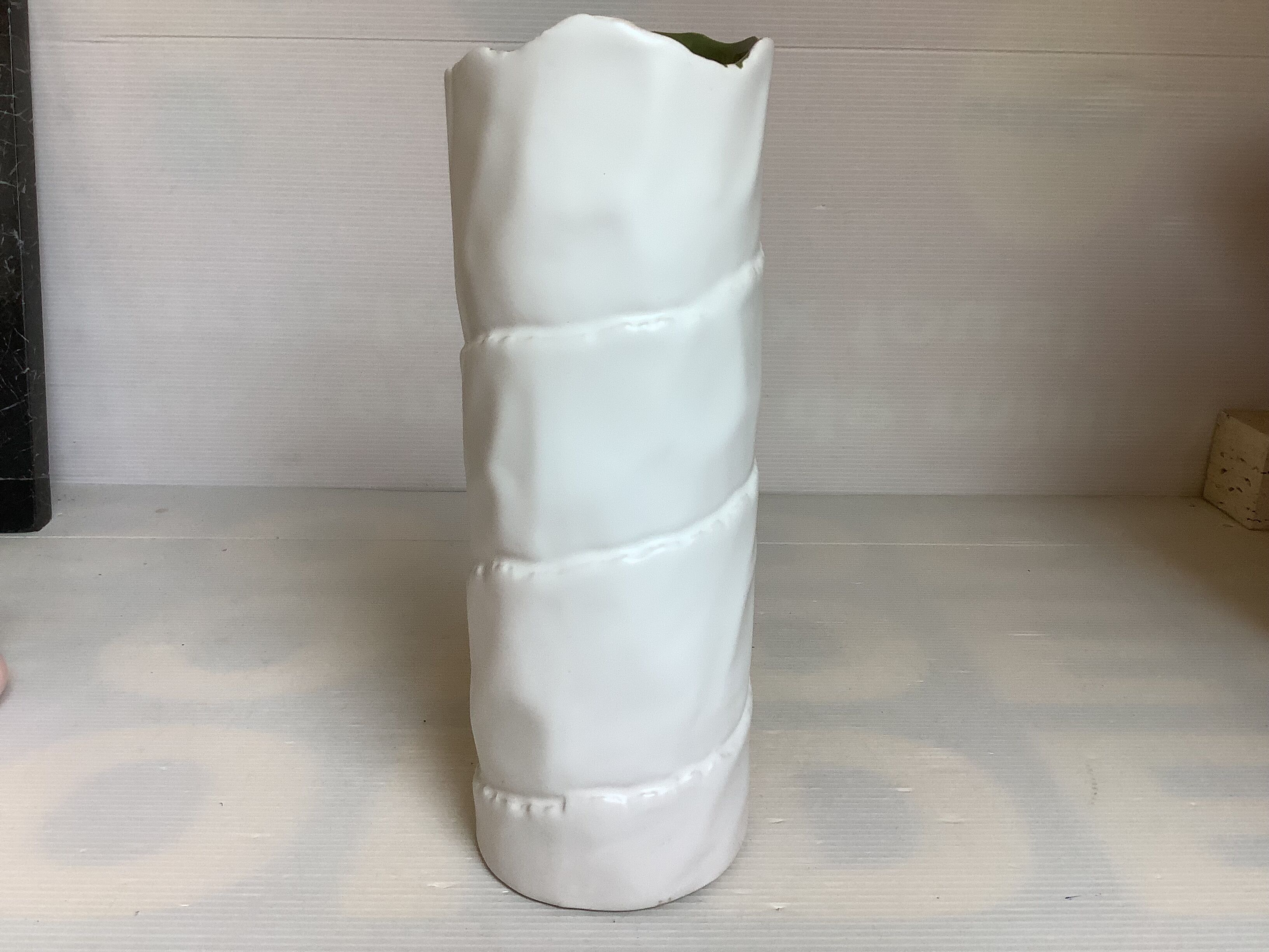 Vase with patterns of rolled paper leaves