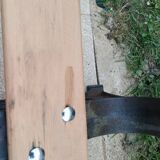 Garden bench with old cast iron legs