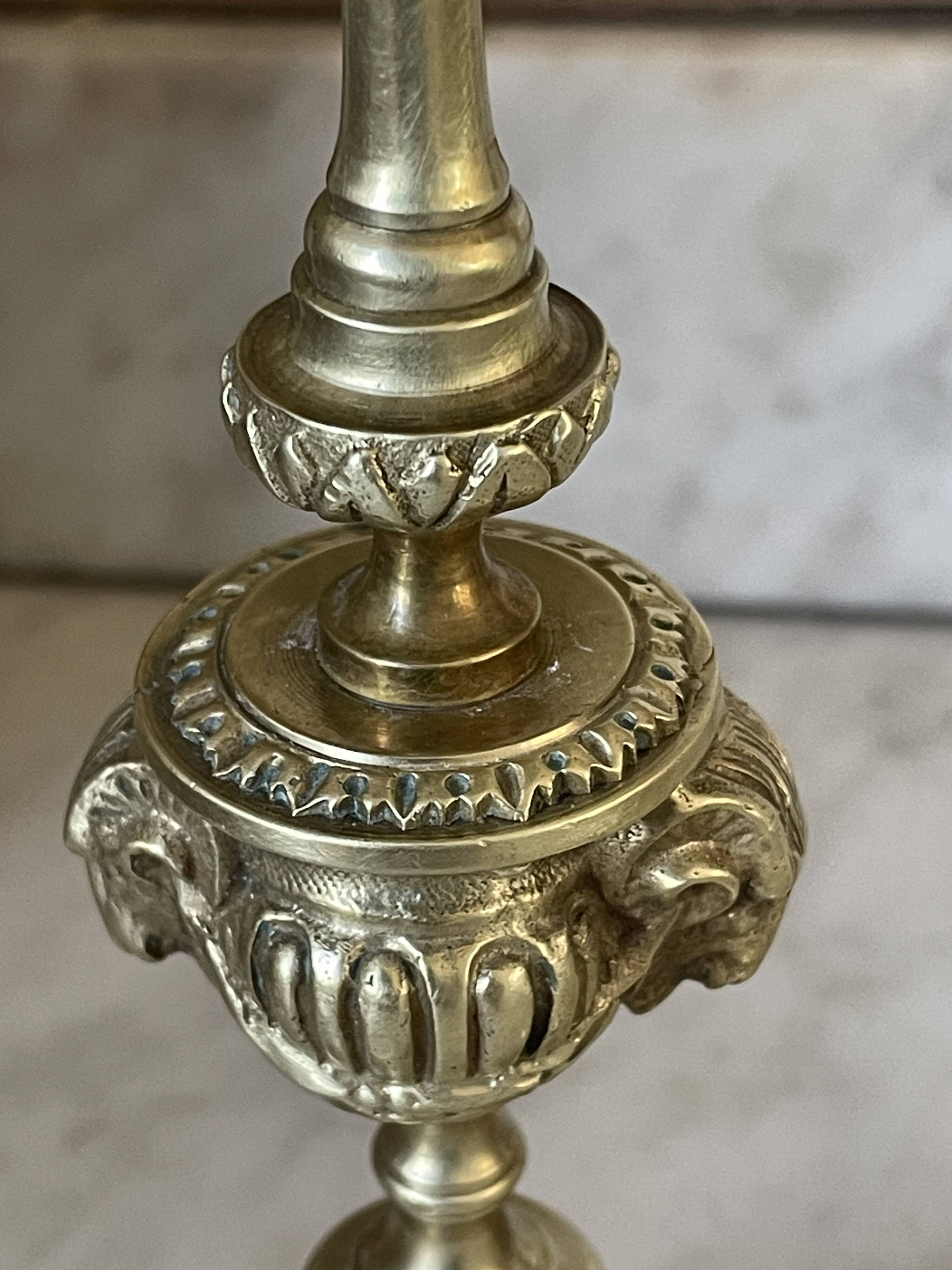 Pair of gilt bronze ram's head candlesticks, Louis XVI style, 19th century.