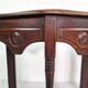 Pair of English 1920s carved oak sidetables