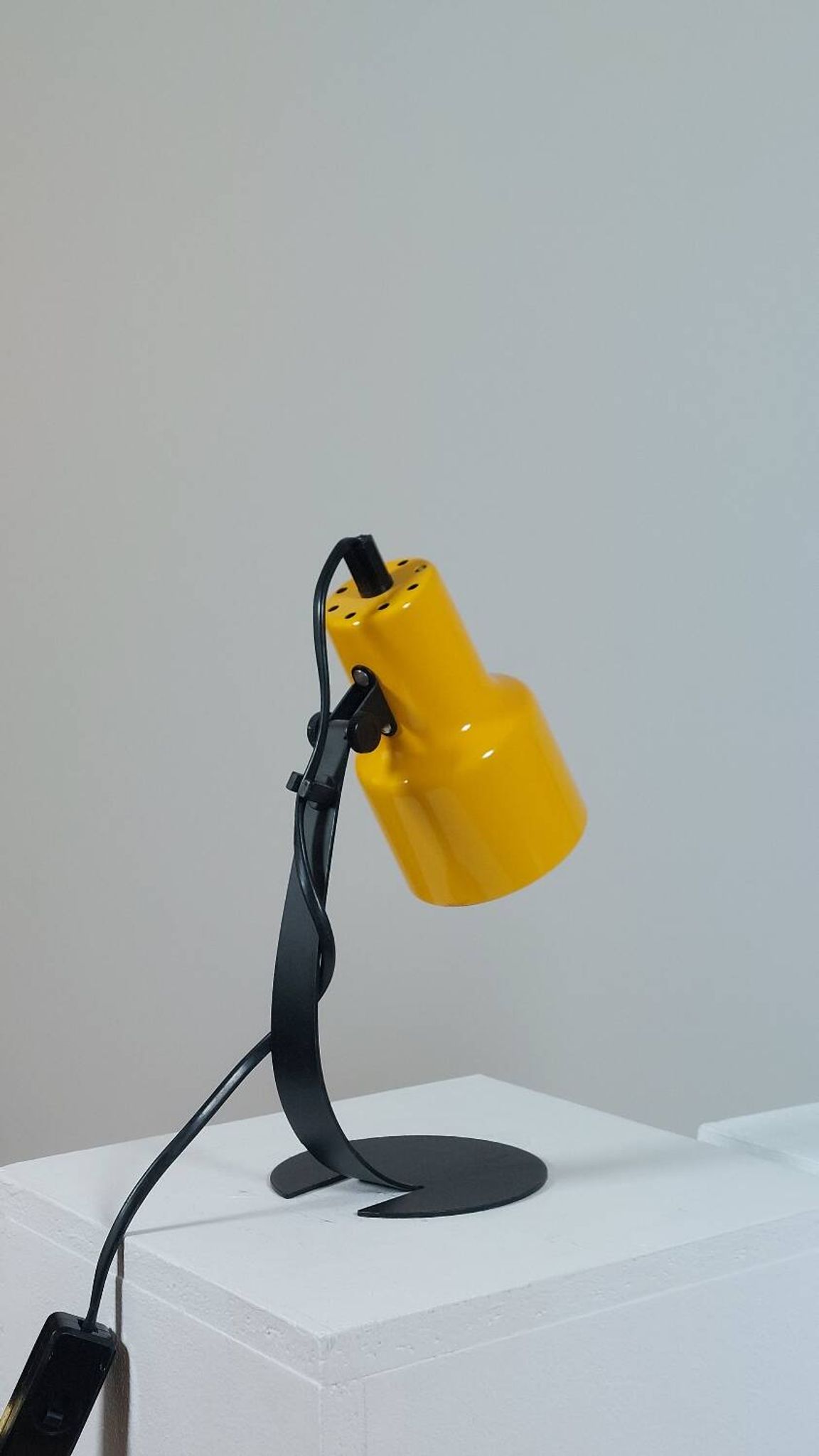A pair of well-designed minimalist bedside lamps.