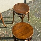 Set of four curved wooden stools stamped Baumann model 92.