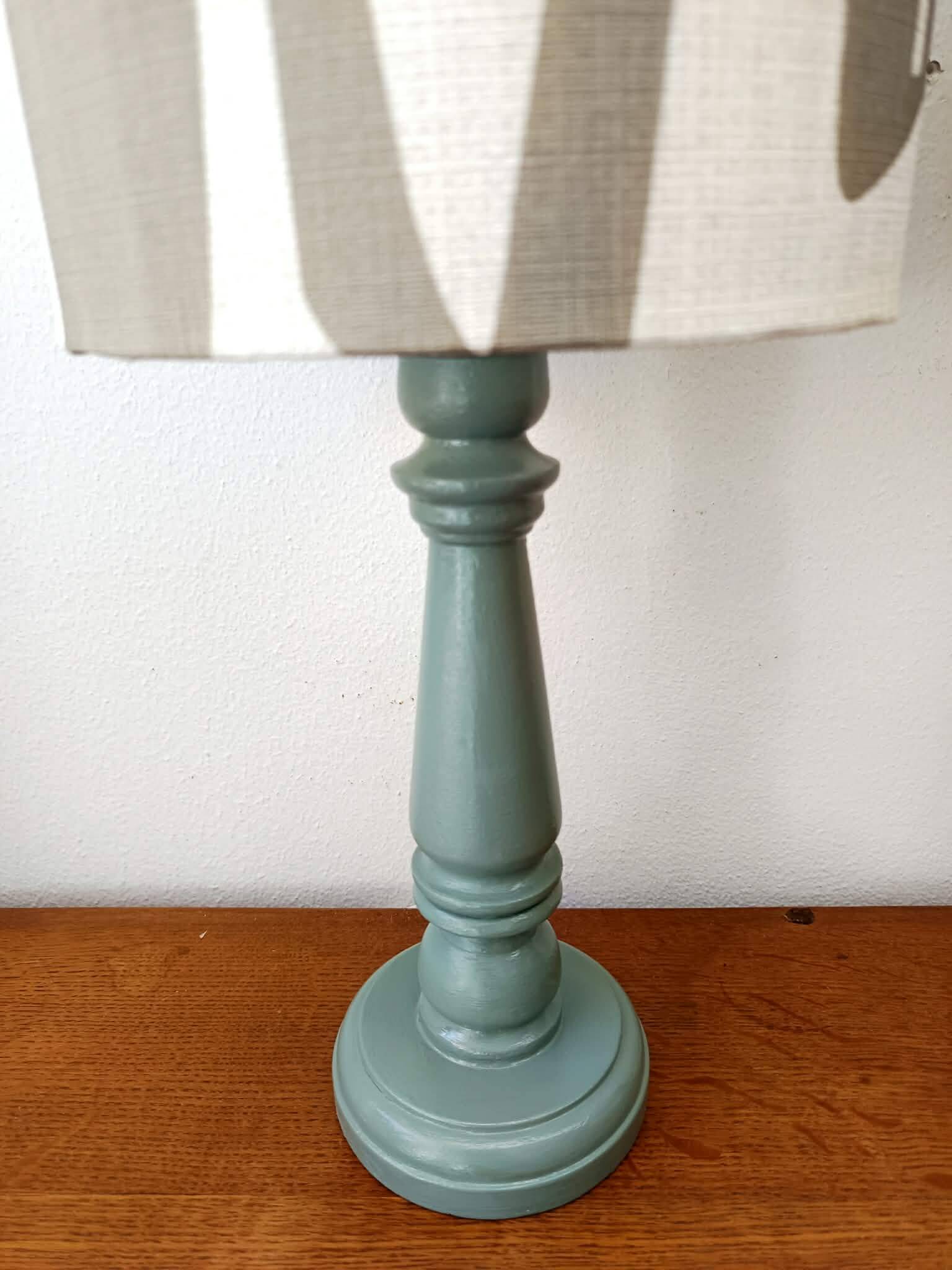 Pair of wooden lamps with custom modernist lampshades.