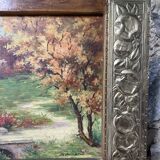 Pair of Art Deco wood and embossed metal landscape frames