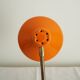 Orange colored metal desk lamp from the 1960s-1970s