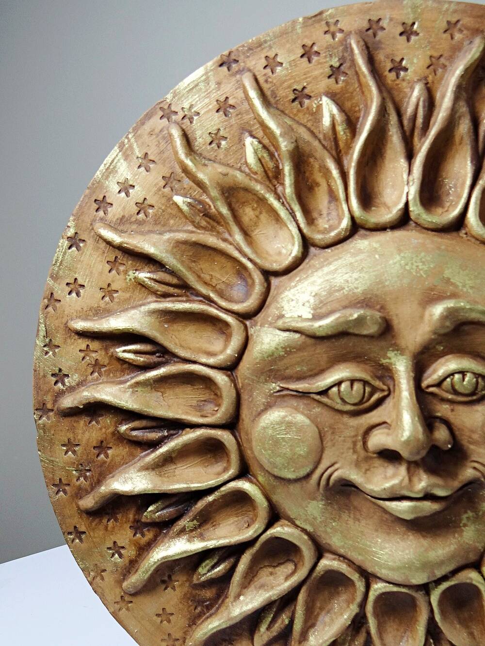 Anthropomorphic sun wall sculpture in patinated terracotta, vintage Italian craftsmanship.