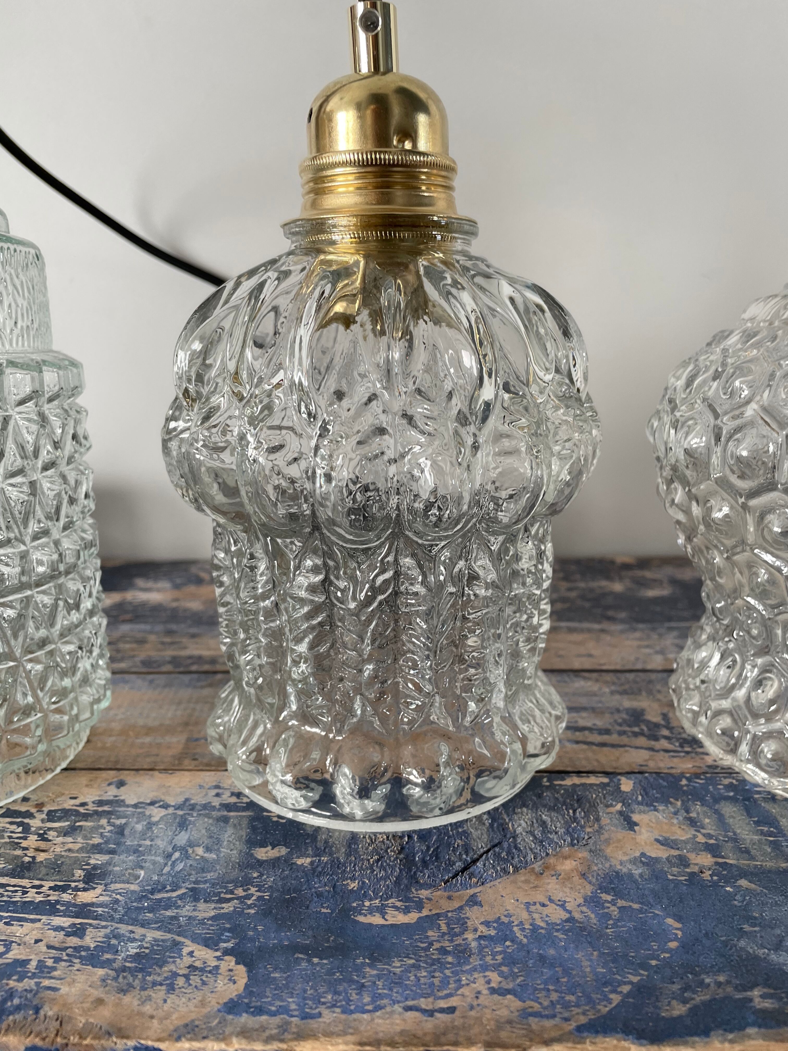 Set of three vintage electrified glass pendant lamps