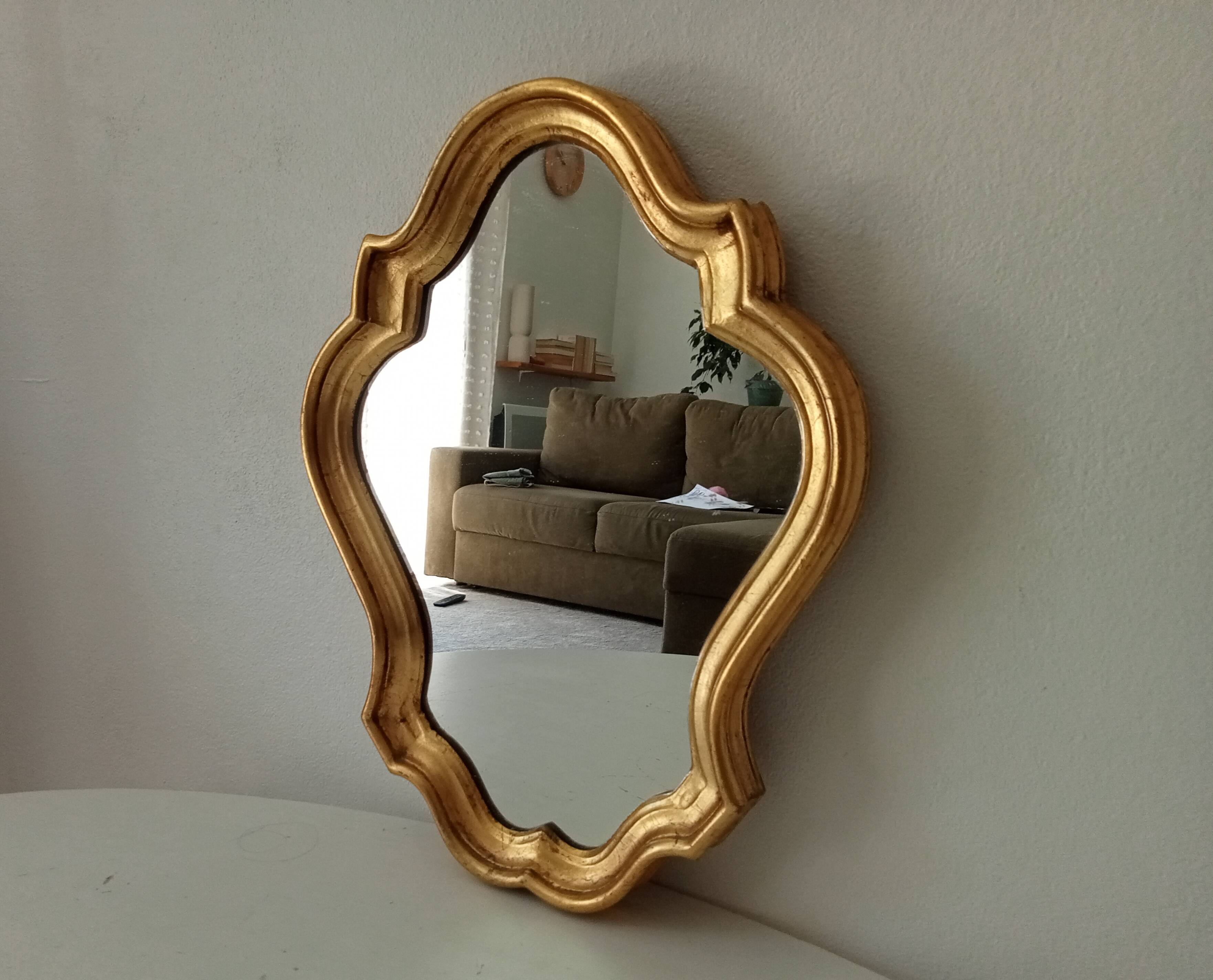 Baroque mirror in gilded wood from the 1960s.