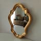 Baroque mirror in gilded wood from the 1960s.