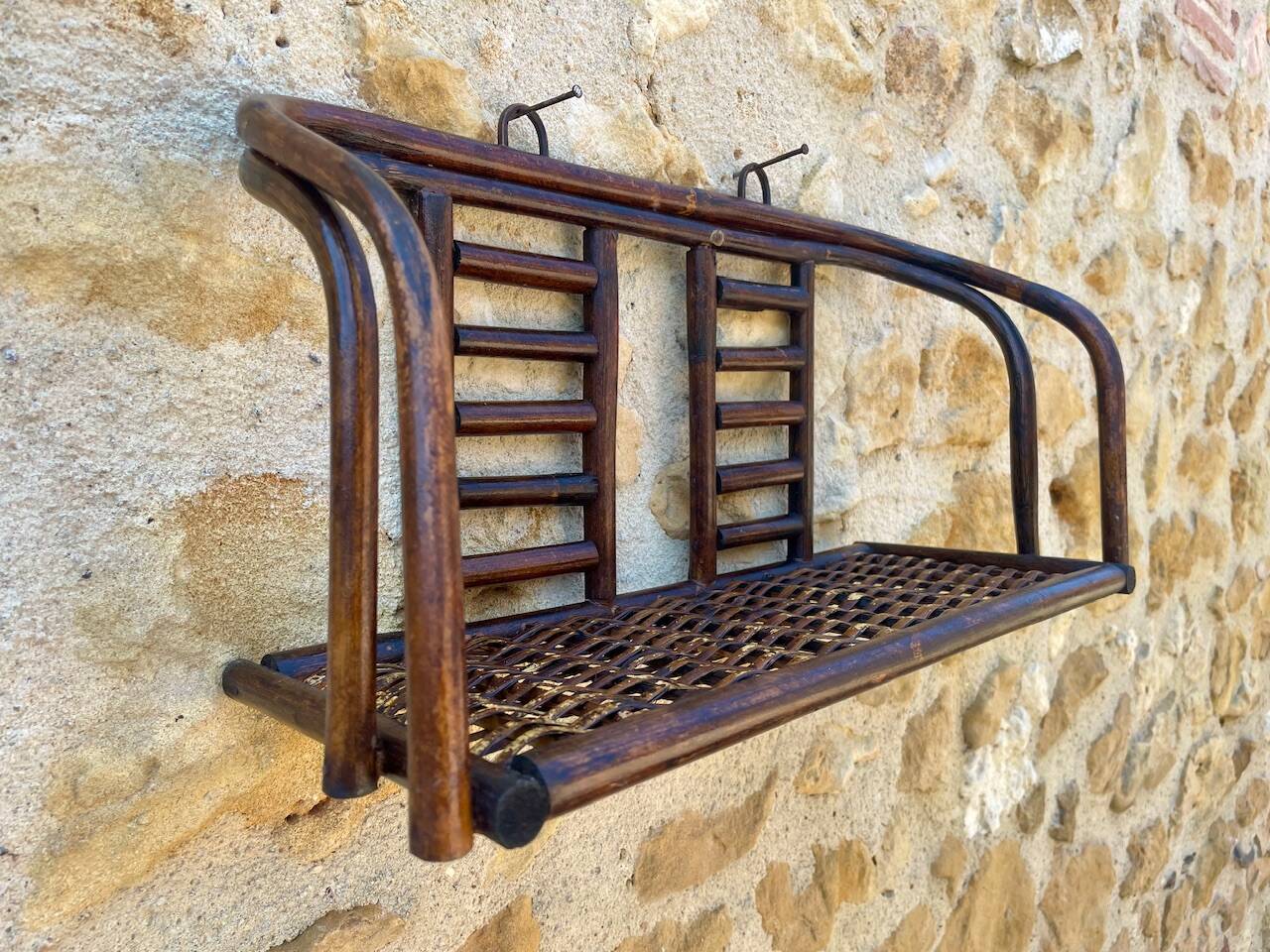 Vintage wall shelf in bamboo and rattan, circa 1960s.