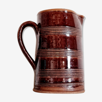 Pitcher in glazed brown terracotta