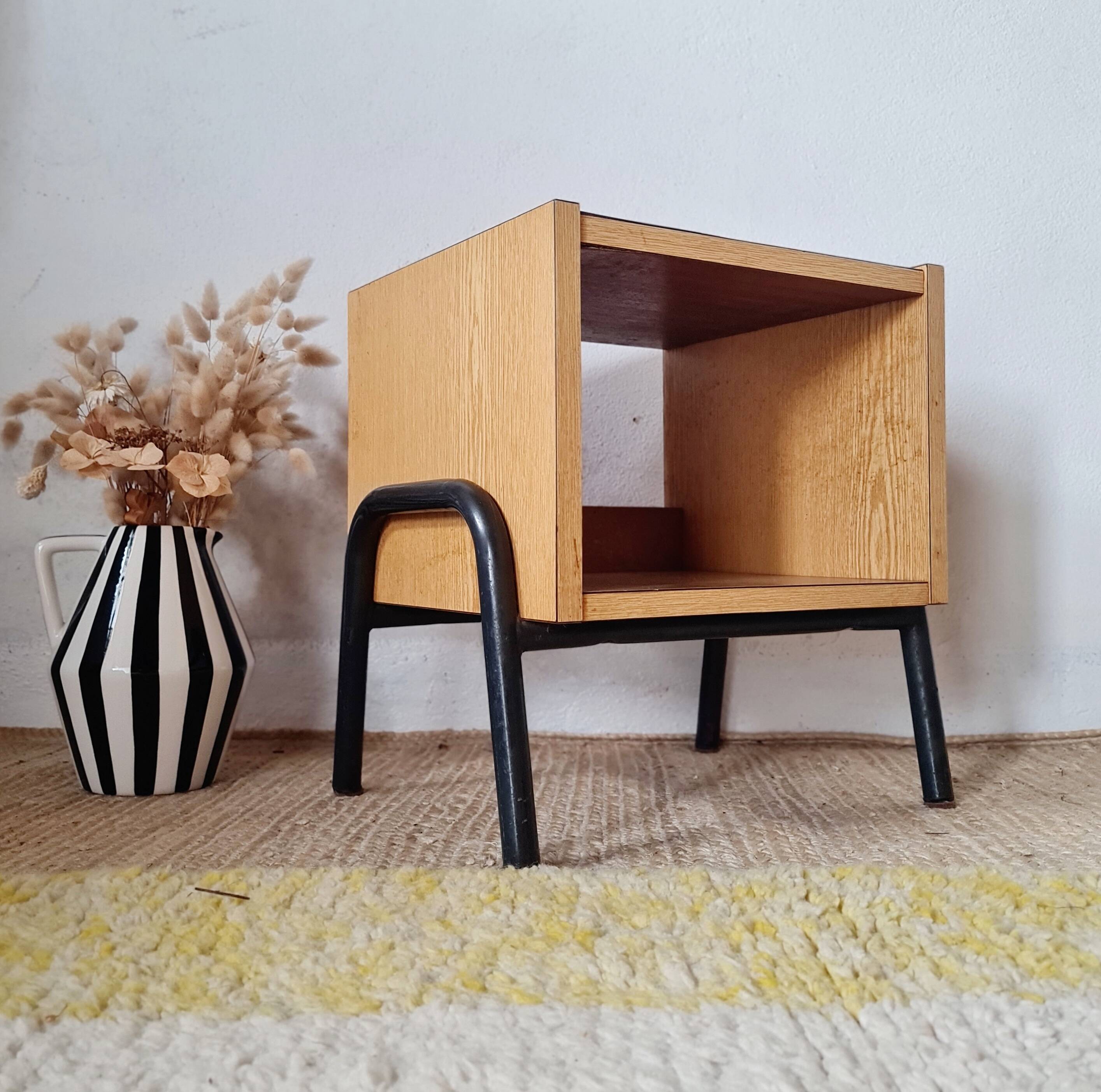 Bedside table - small wooden piece of furniture with a tubular metal base.