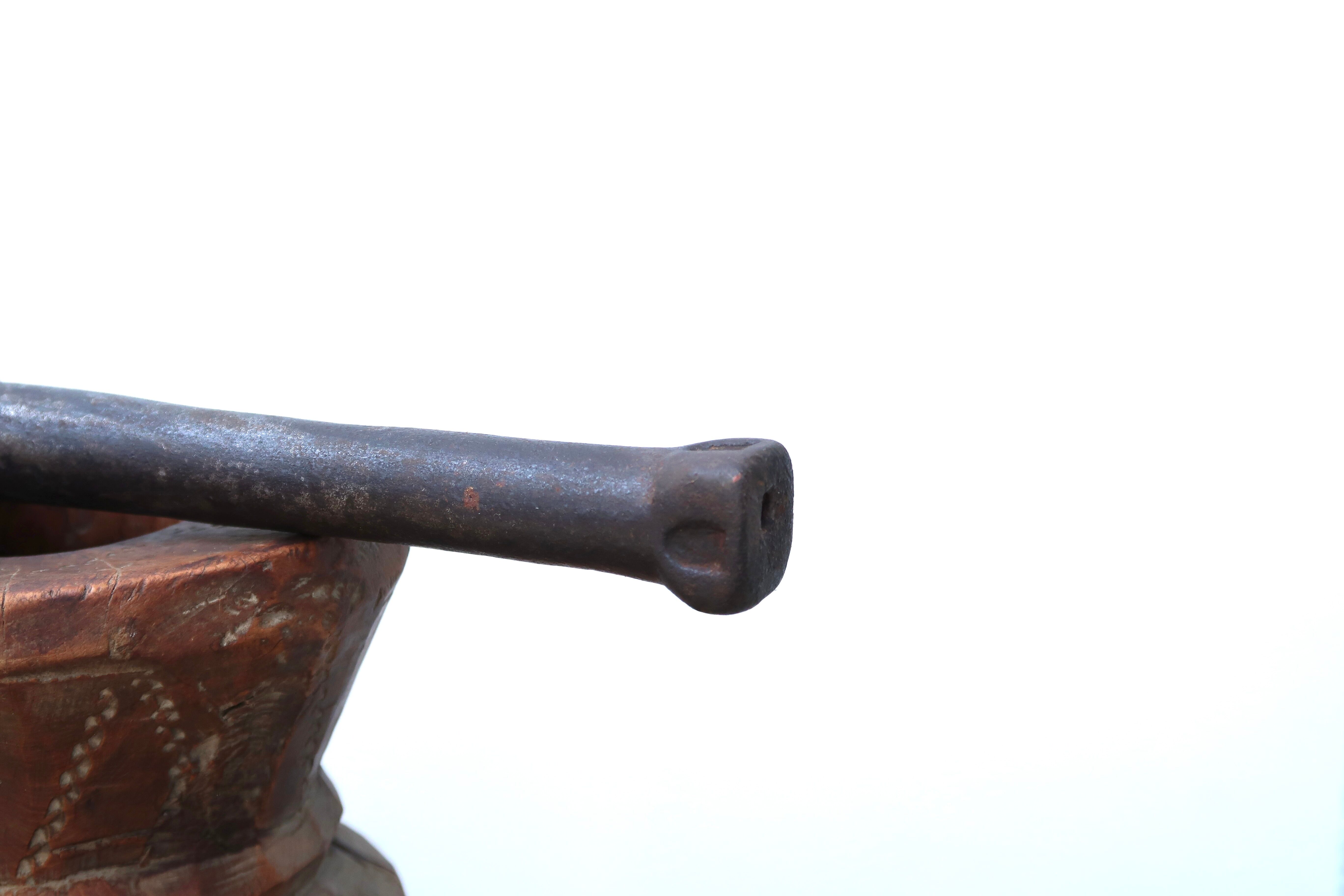 African mortar in carved wood, cast iron pestle, 70s