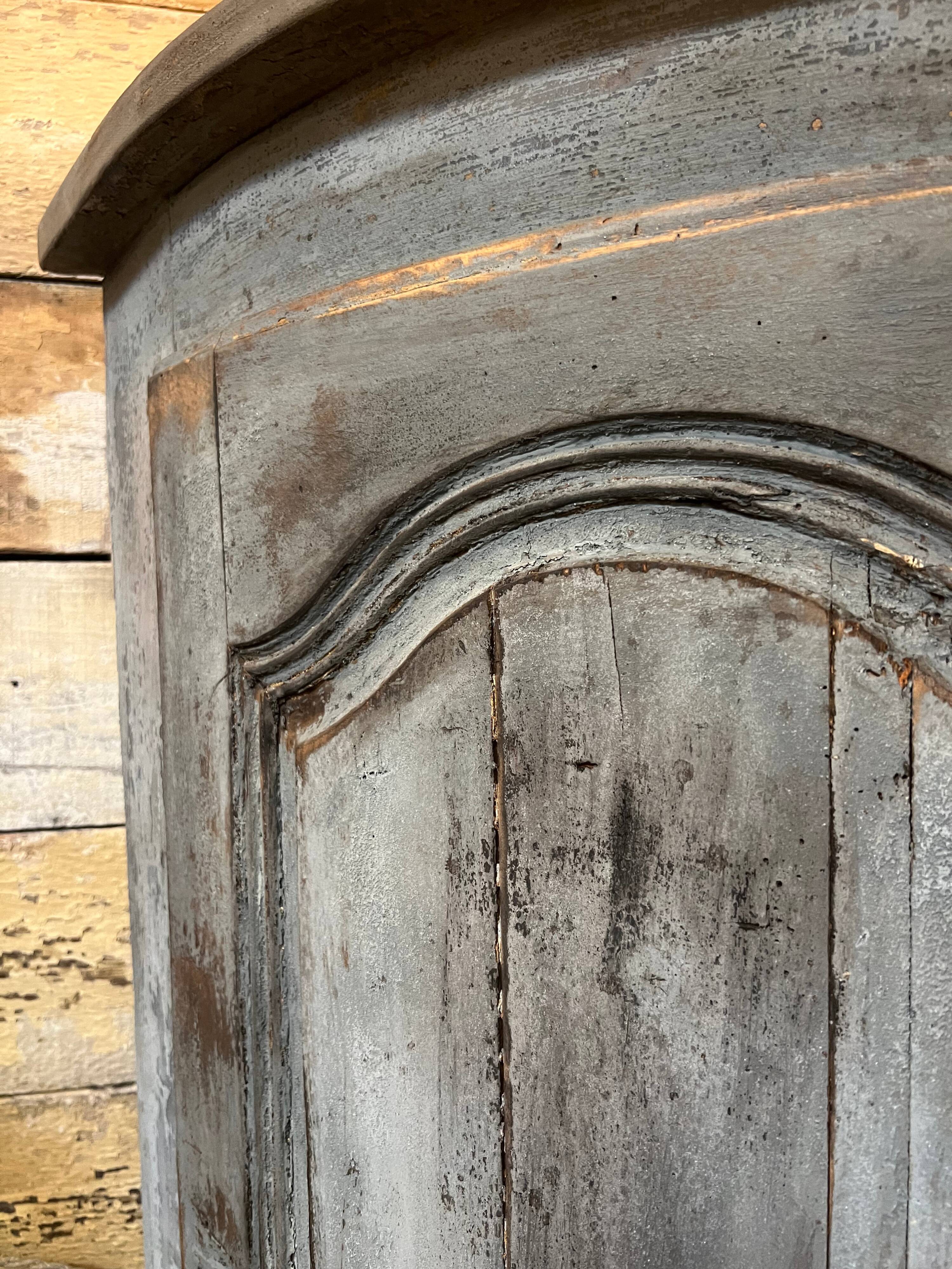 Eighteenth-century corner cabinet with a patina.