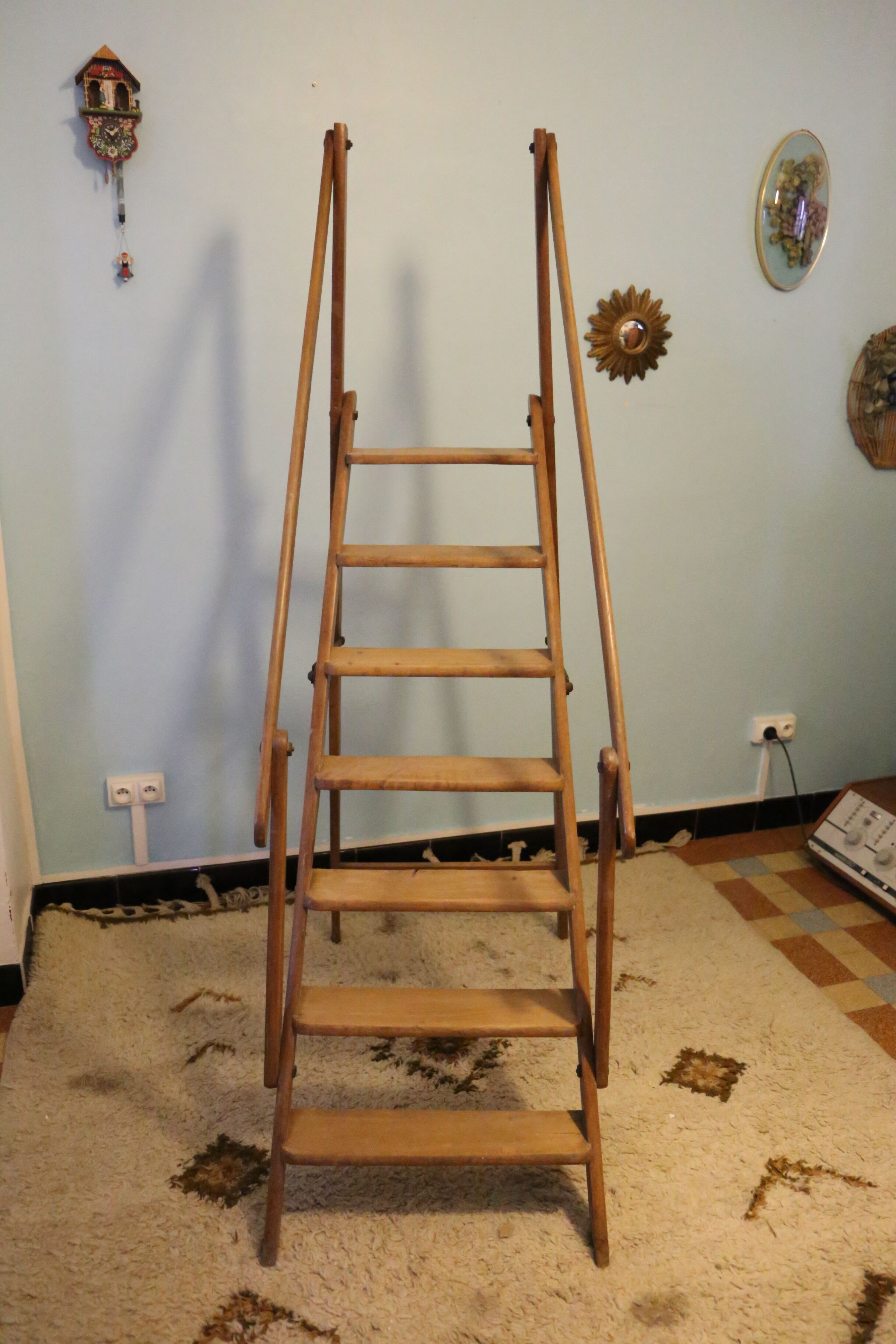 Old wooden stepladder with bodyguards