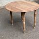 Renovated 18th century solid wood extendable round dining table with shutters