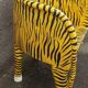 Wooden armchair with a "tiger" appearance.