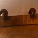 Old wooden coat rack with 2 hooks