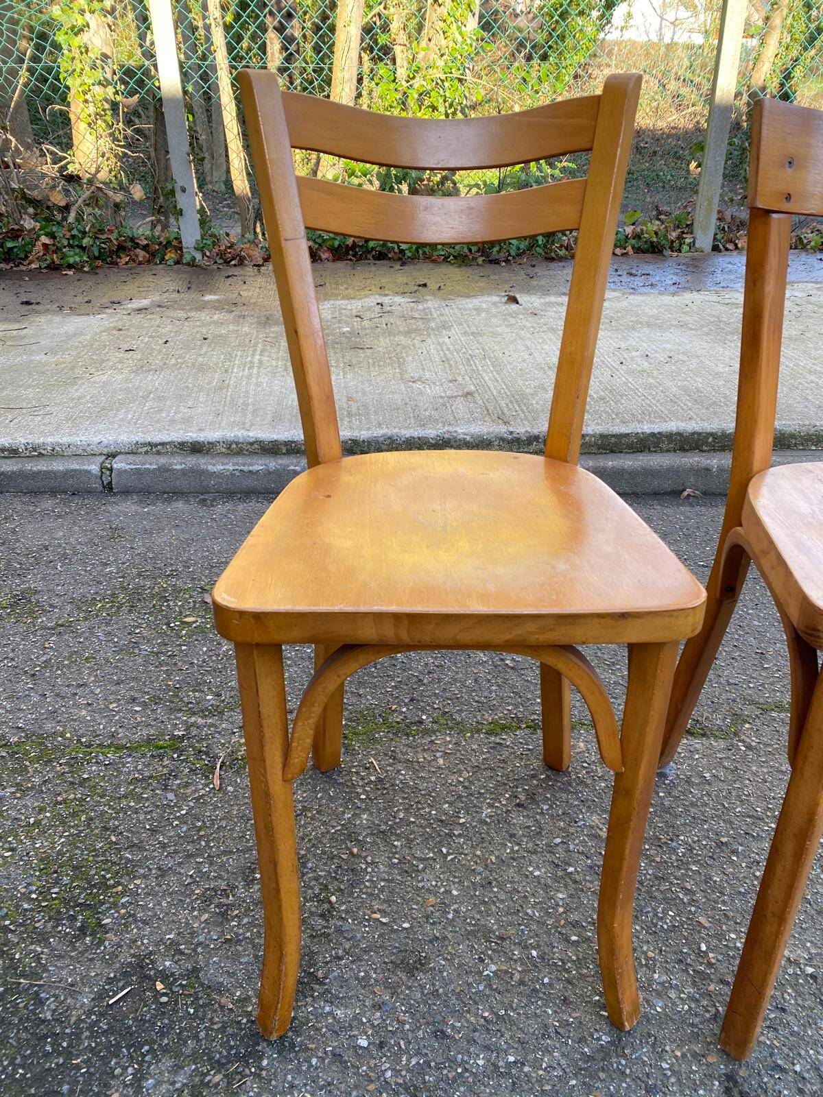 2 Scandinavian bistro chairs by Baumann in light wood from 1980.