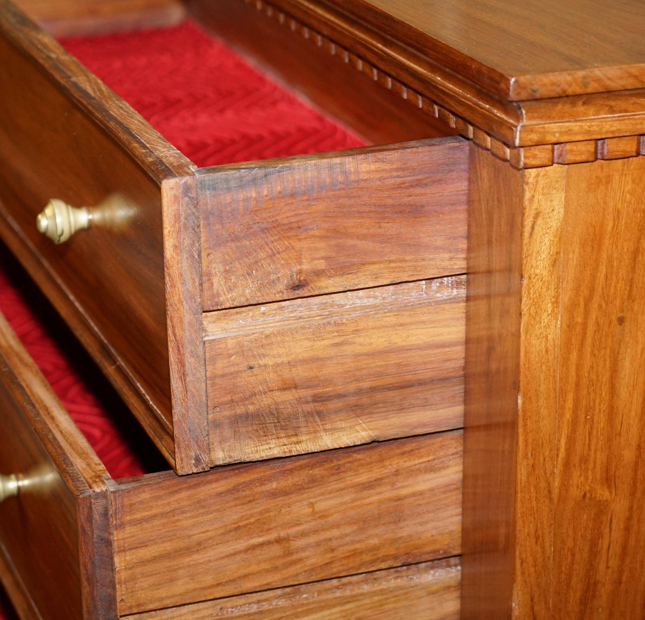 Set of hardwood dressers with finely carved bases.