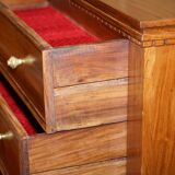 Set of hardwood dressers with finely carved bases.