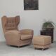 Beige wingback armchair and TVAR footrest, former Czechoslovakia.