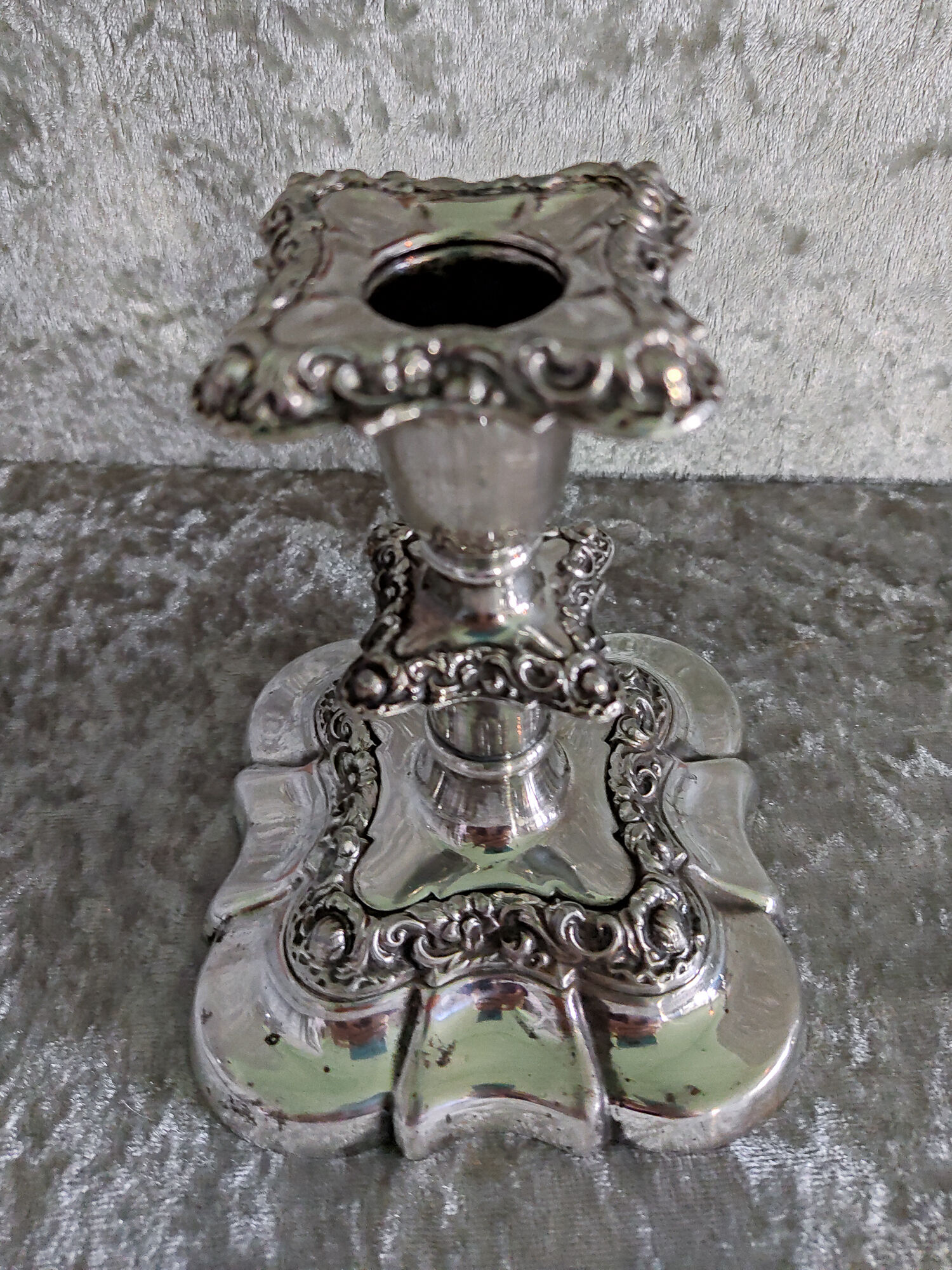 Pair of silver metal candle holders