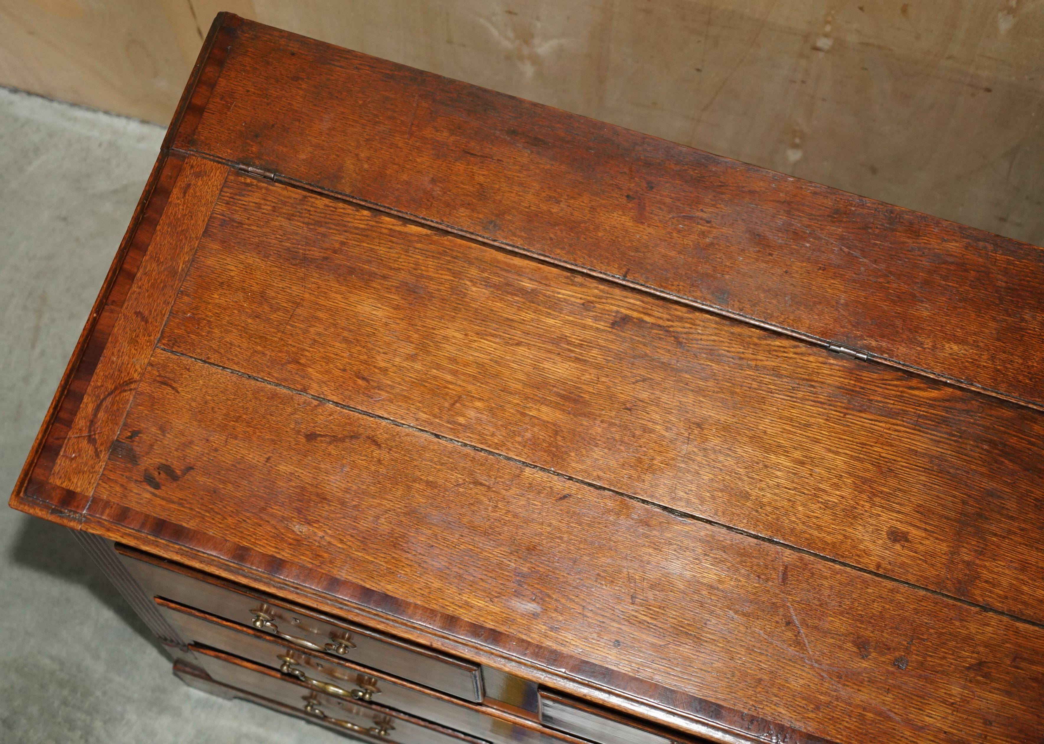 Georgian oak commode with a folding top, English, 18th century.