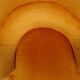 Fauteuil crapaud en velours jaune