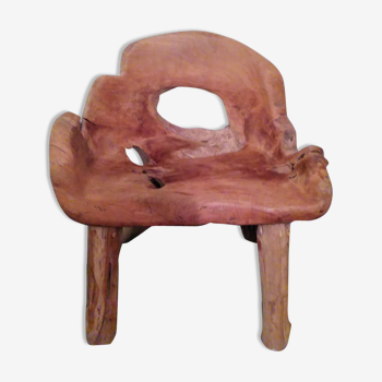 Chair carved from a piece of wood