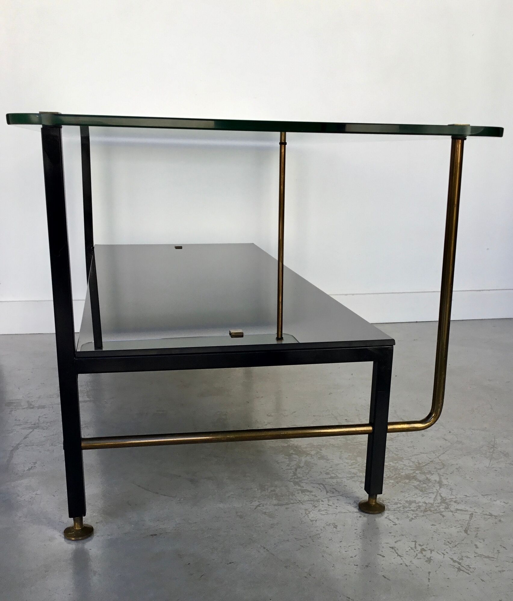 Modernist coffee table in metal tubular base and glass top 1950