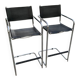 Set of 2 mid-century tubular black bar stools in faux leather and chrome metal.