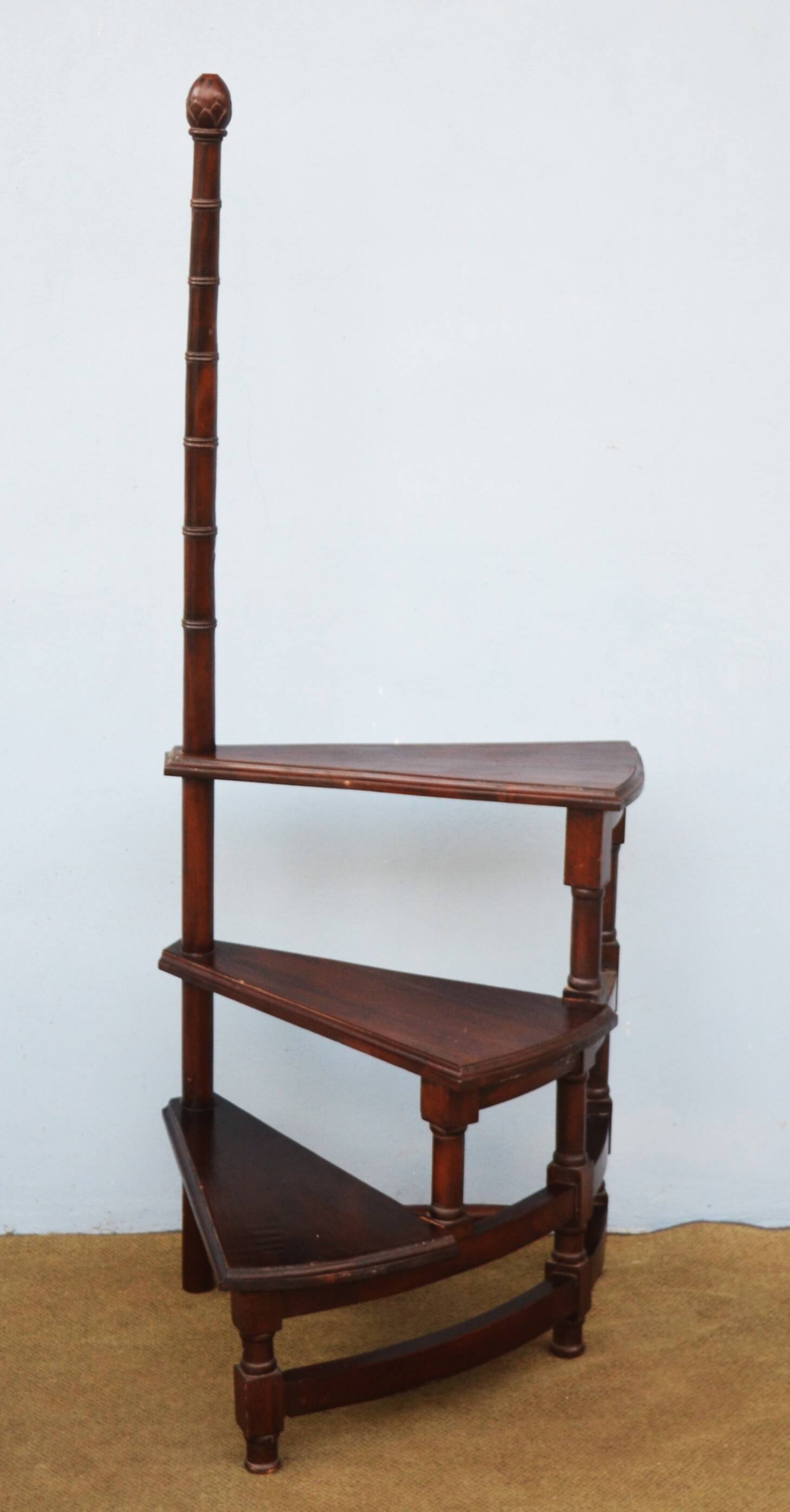 Spiral staircase for library made of mahogany wood