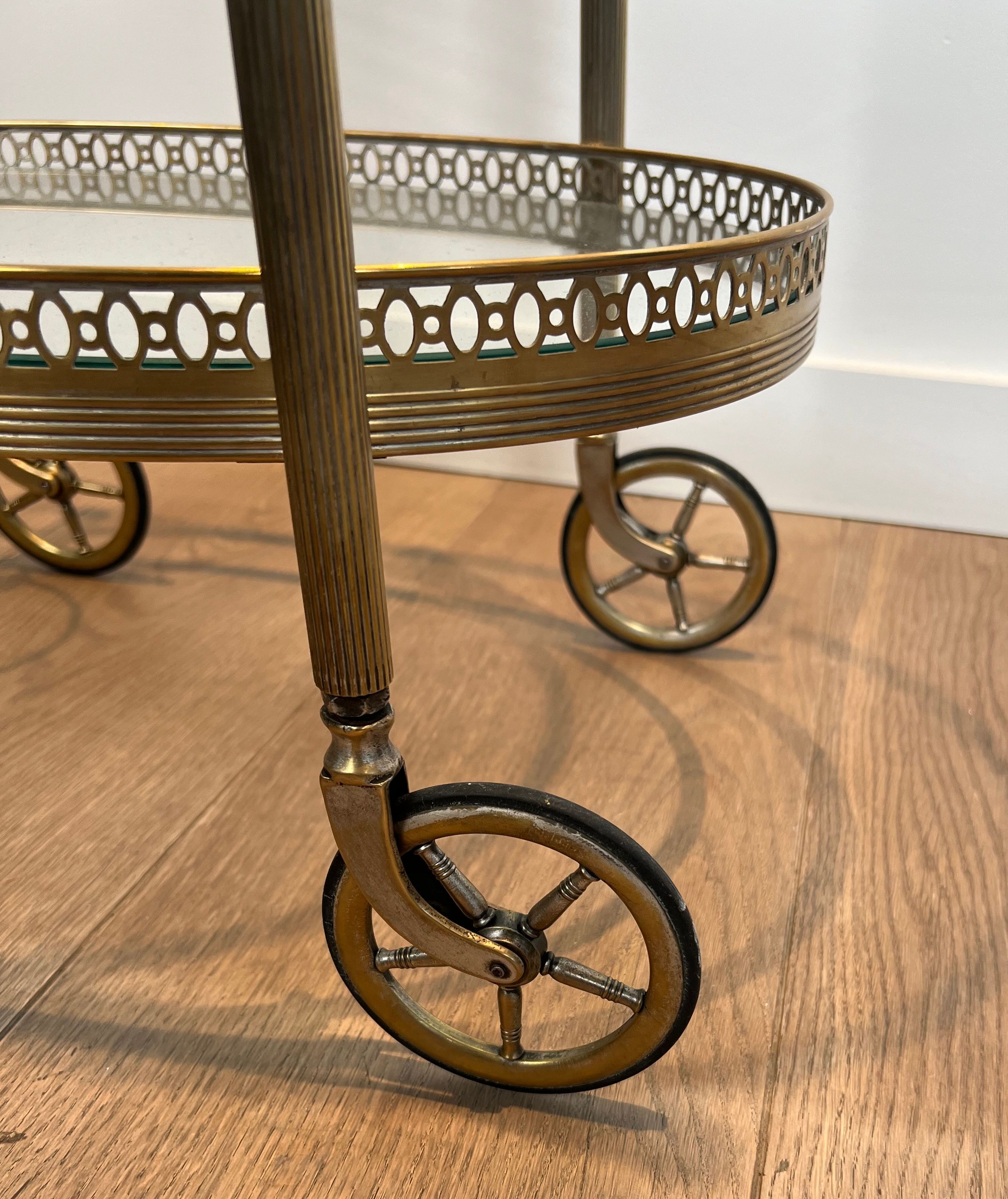 Small wheeled table in silvered brass from the Baguès house.