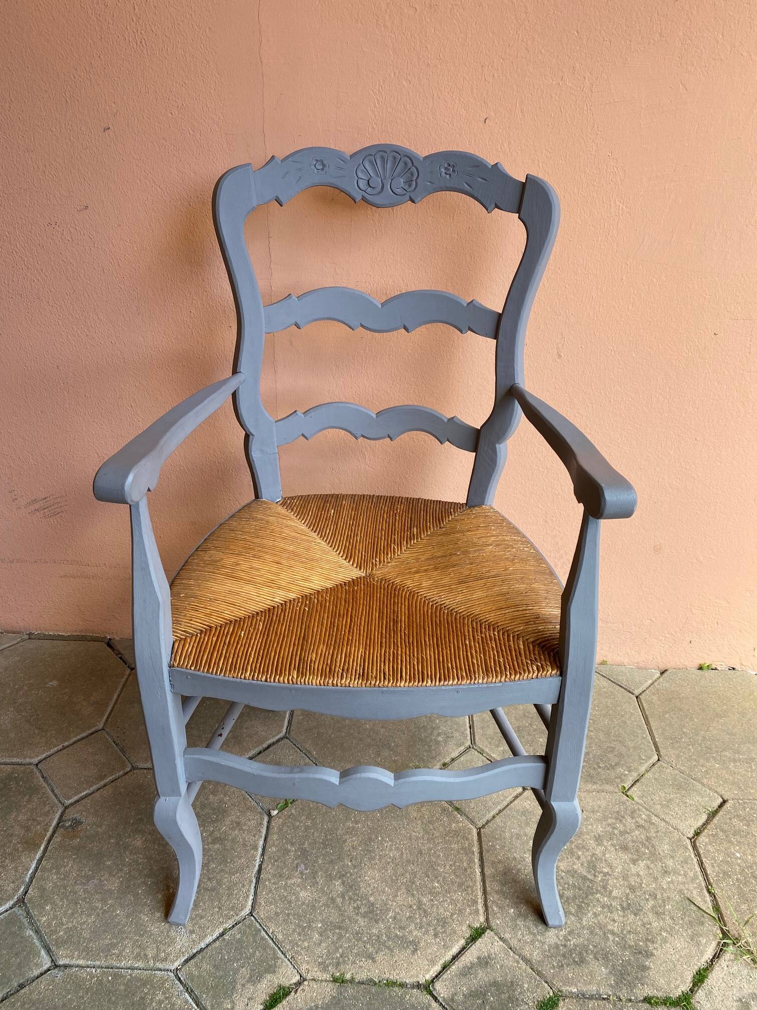 Provencal style straw armchair with gray blue patina armrests