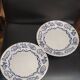 Pair of Castellania plates from Italy with blue fish decoration.