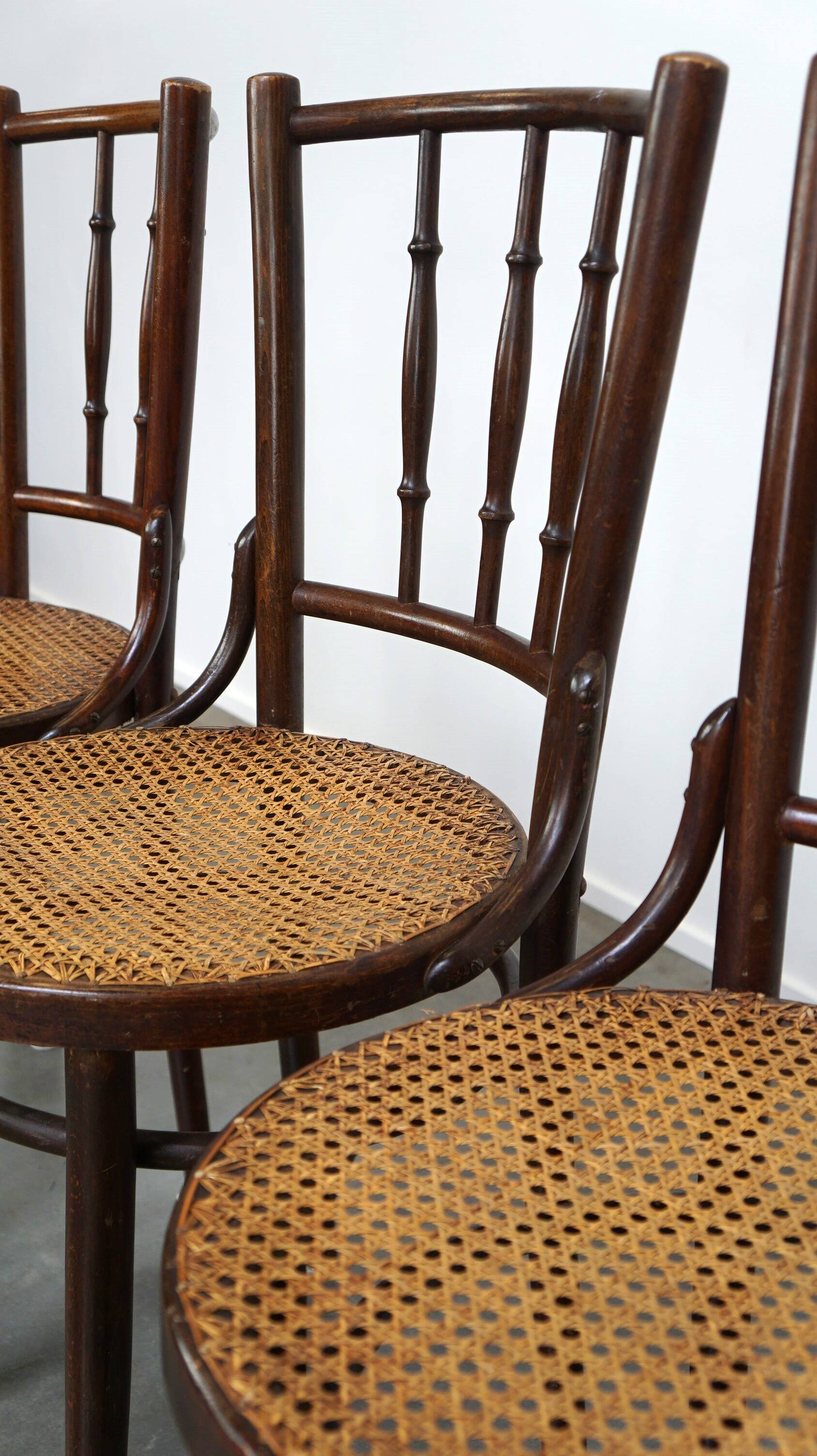 4 antique wooden and cane bistro chairs