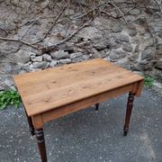 Vintage pine table with drop-leaf extension and turned beech legs, France, 1930s.